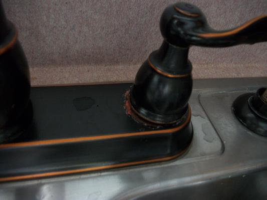 clear coat has failed and "paint?" is gone from from base under handle leaving bare metal