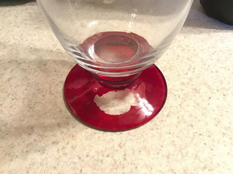 Paint chip from water goblet.