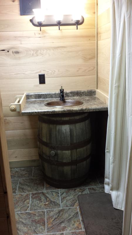 Old whiskey barrel as the vanity.