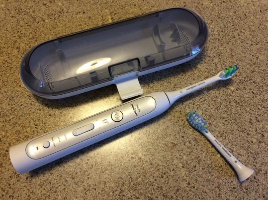 Brush handle, case, and extra brush.