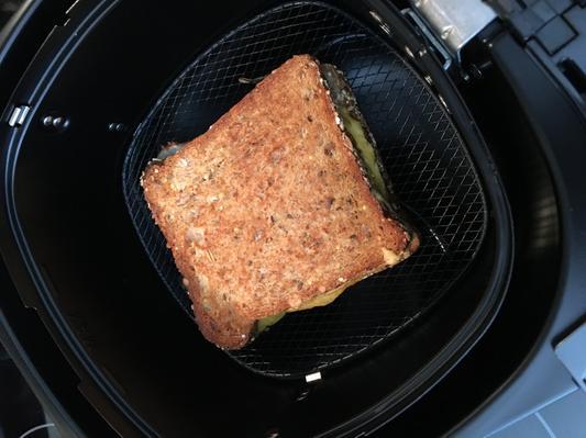 Grilled ham and cheese with onion