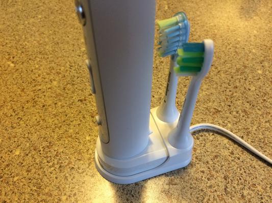 Brush holder in the back of the base.