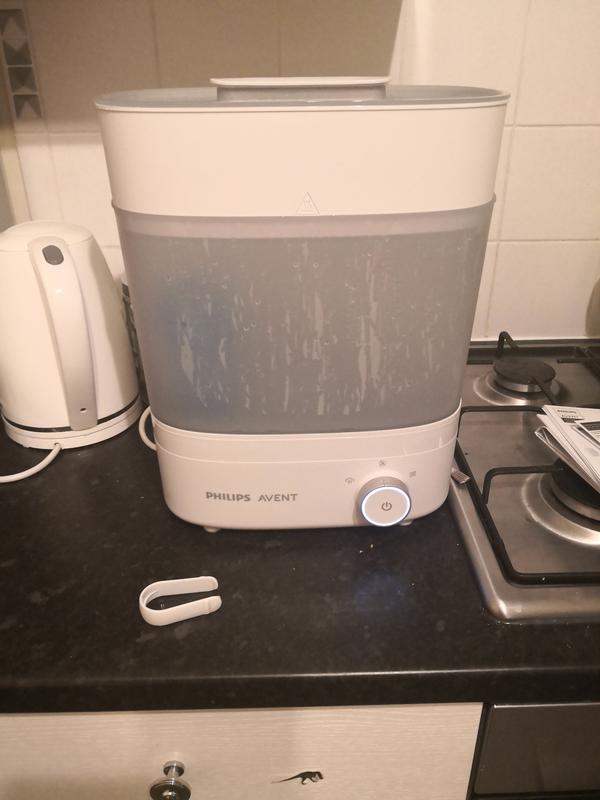 Steriliser with tweezers