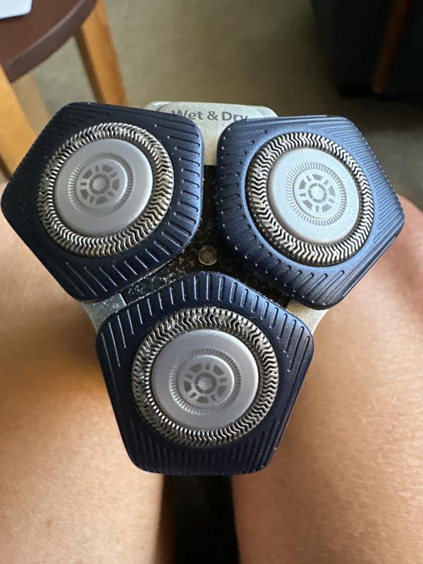 1/4 inch from rotating blade to edge of shaver head. 1/8 inch distance from rotating blade to edge