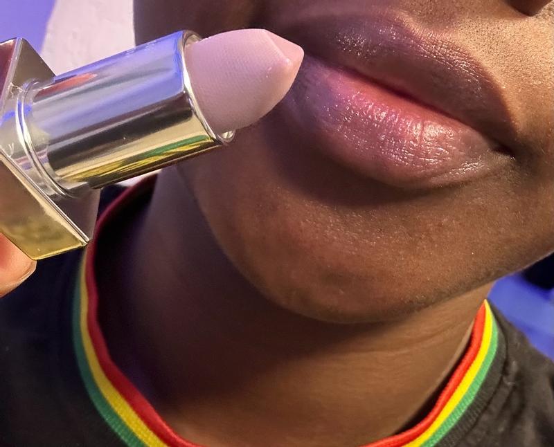 Customer photo for "A luxurious, lightweight lip balm that moisturizes my lips with a sheer pinky-lilac tint and beautiful shimmer for an effortless everyday glow."