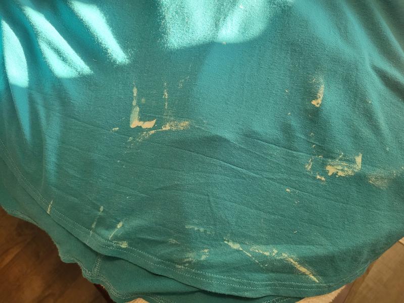 My 2 expensive tops. Bleach spots on back.