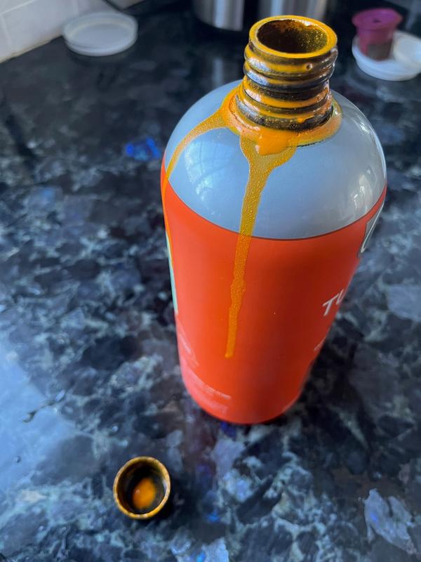 You need better adhesive for the cap seal to avoid an orange mess