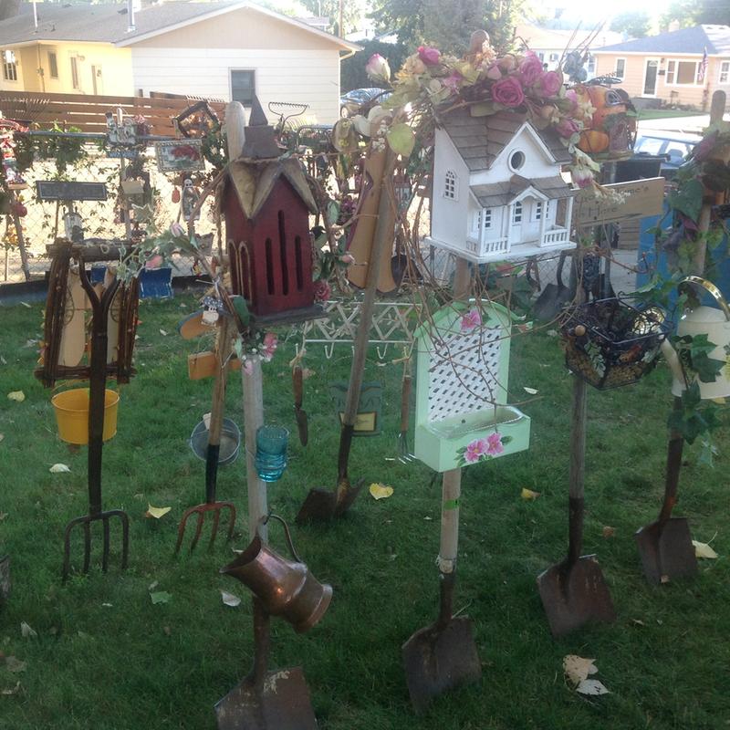 Garden art... With bird houses...with signs, solar lights and bird house... Other wood things..