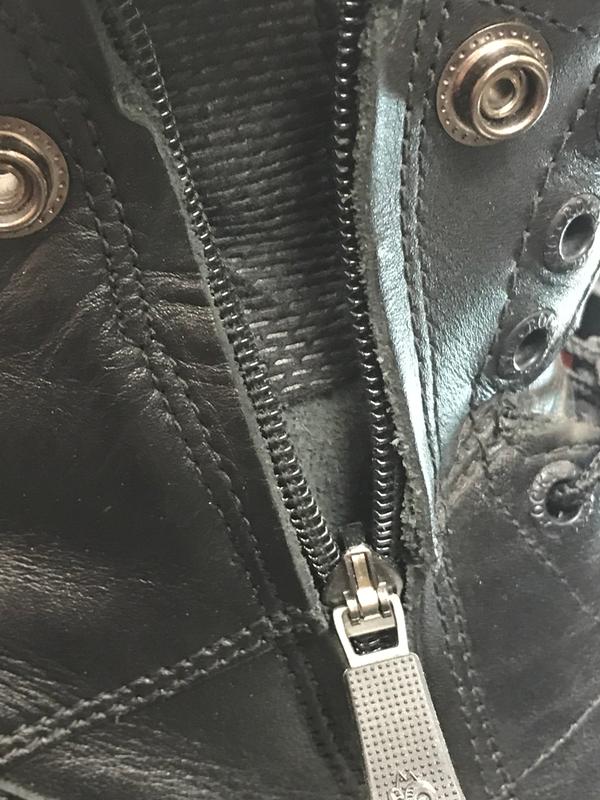 Left boot’s zipper in the down position