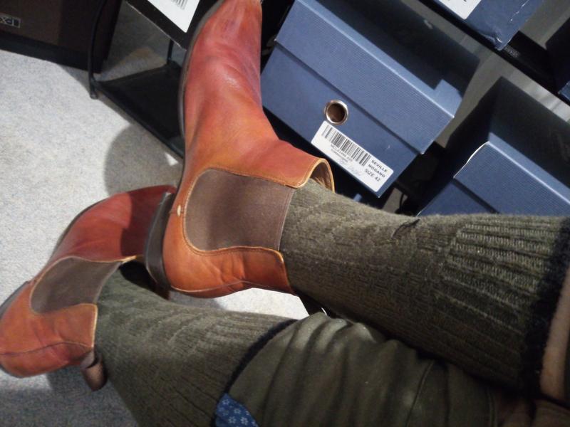 Wearing tan Pulp boots over olive Dunedin Cable Socks, with R&G logos visible on inside leg & colour-matching trim.