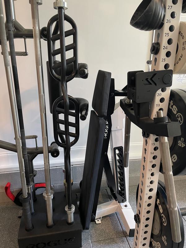 Bench stored nicely out of the way behind my rack by my barbell holder