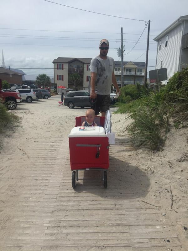 Mommy is taking the picture of Daddy pulling me in my New Wagon