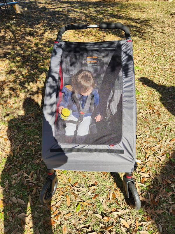 Baby sling outlet for bike trailer