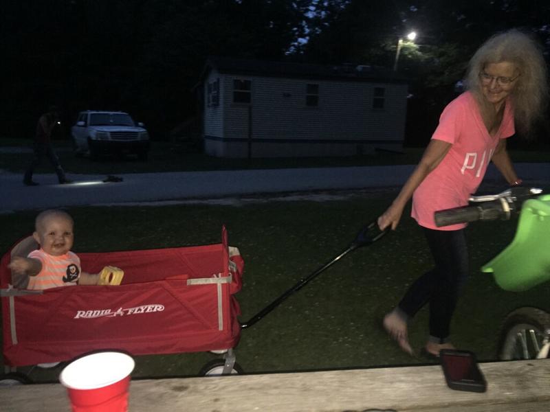 MeMaw pulling Dallas Ray in his New Radio Flyer Wagon for his Birthday plus MeMaw's birthday