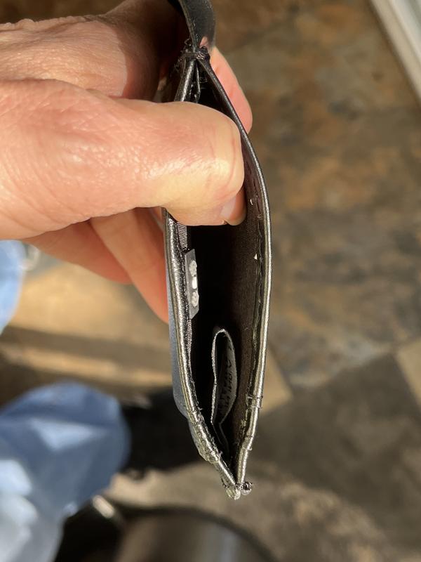 pocket for folded bills or possibly business cards or other card