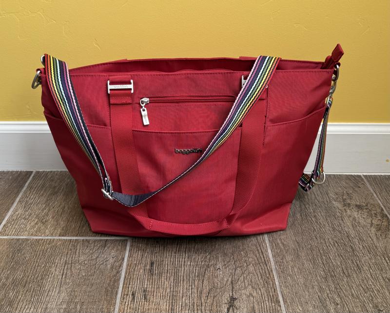 The bag with the rainbow strap.