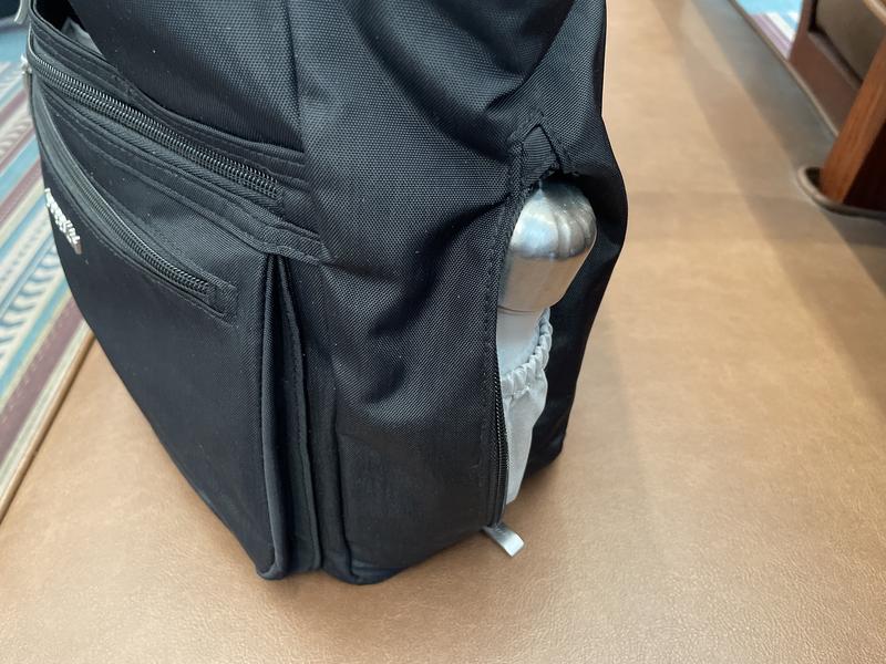 Wee water bottle sleeve tucked into the bag.