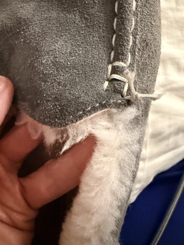 The first photo shows what the stitching should look like, the second shows that I had to tie the unraveling threads into a knot to prevent further issues