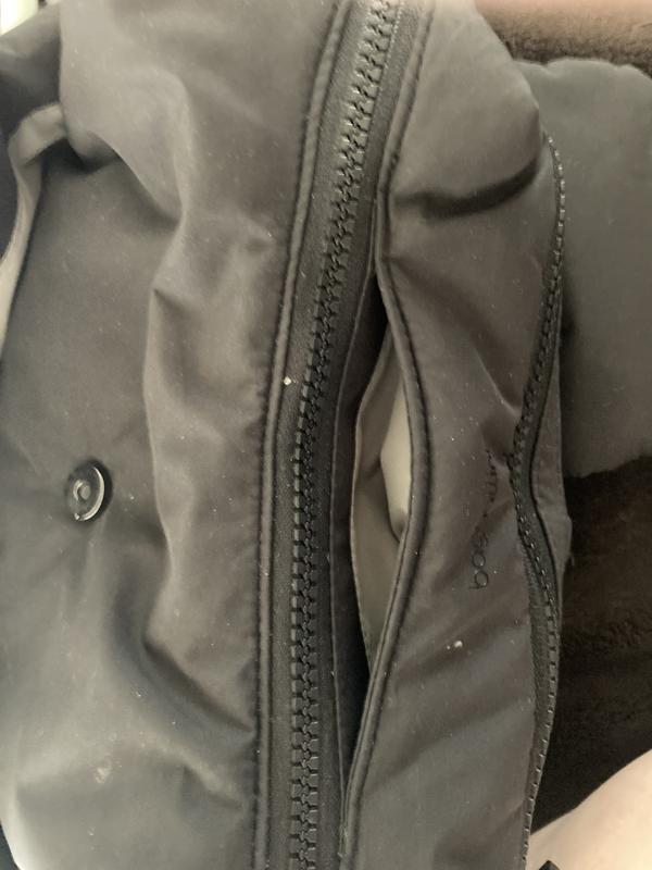 Stitching to front of center zipper coming loose