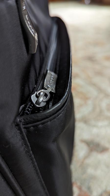 Here is where rain will collect on top of the bottom zippered pocket