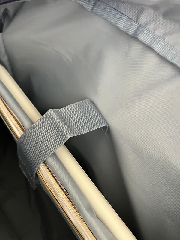 Illustrates how the contents fall forward because the strap/velcro is not flexible in how it is secured.