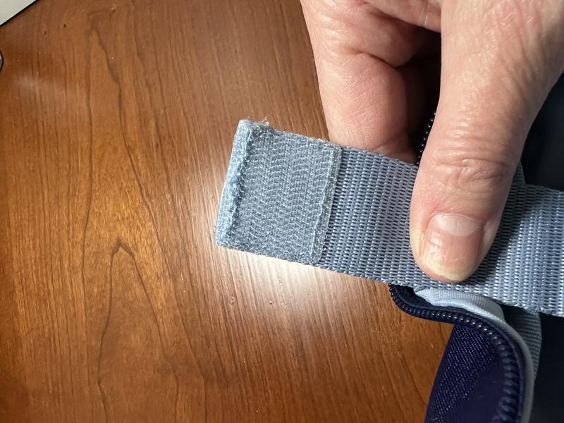 Velcro attachment on the laptop pocket strap