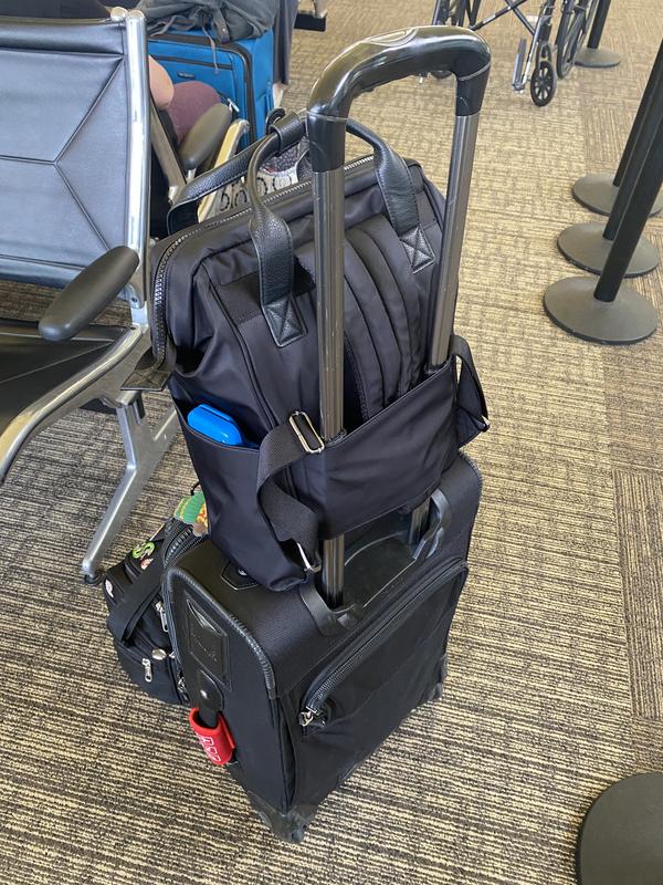 Fits on my suitcase perfectly, and peep the pocket for my work tablet/phone!