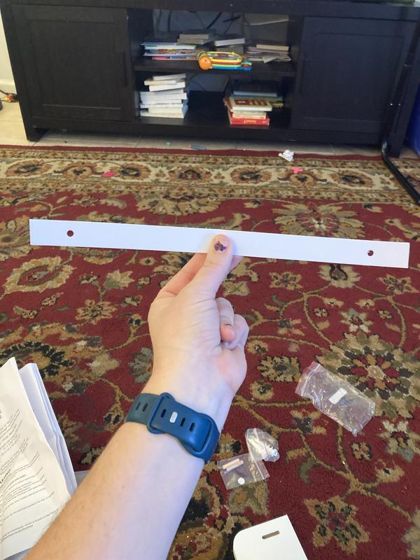 This strip of paper folded up into the instructions tells you exactly where to put the drywall screws. So helpful