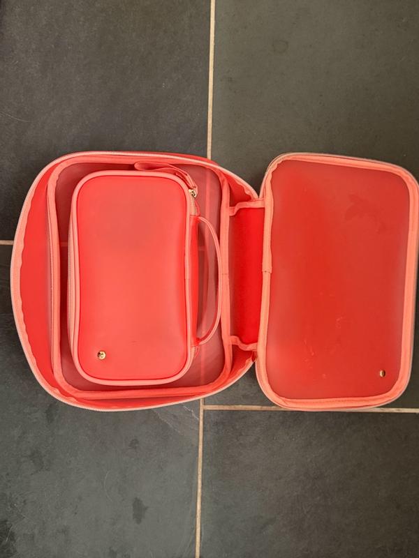 Customer photo for "These bags hold a lot of make up and bathroom items."