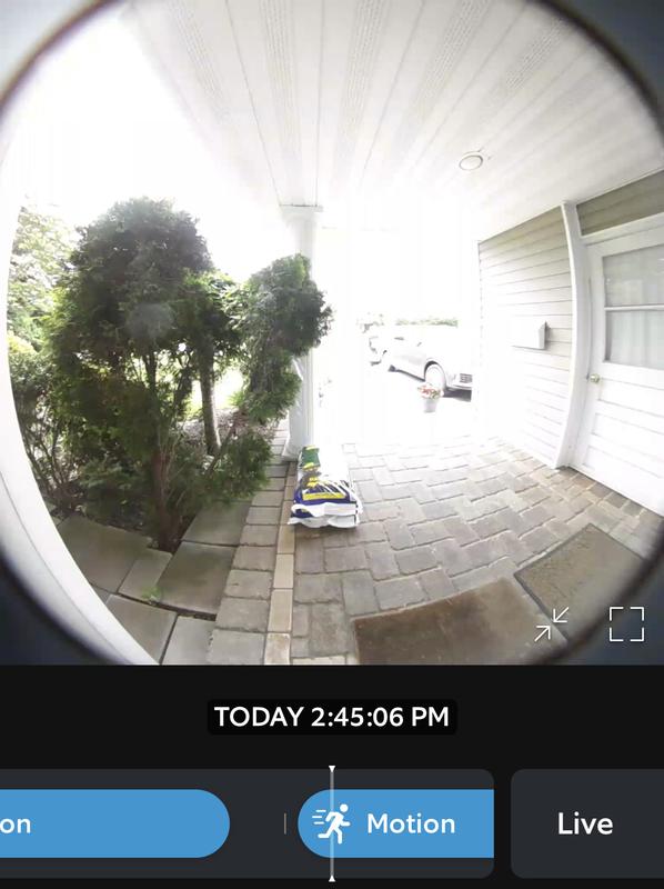 A mail person at the center walking toward the door