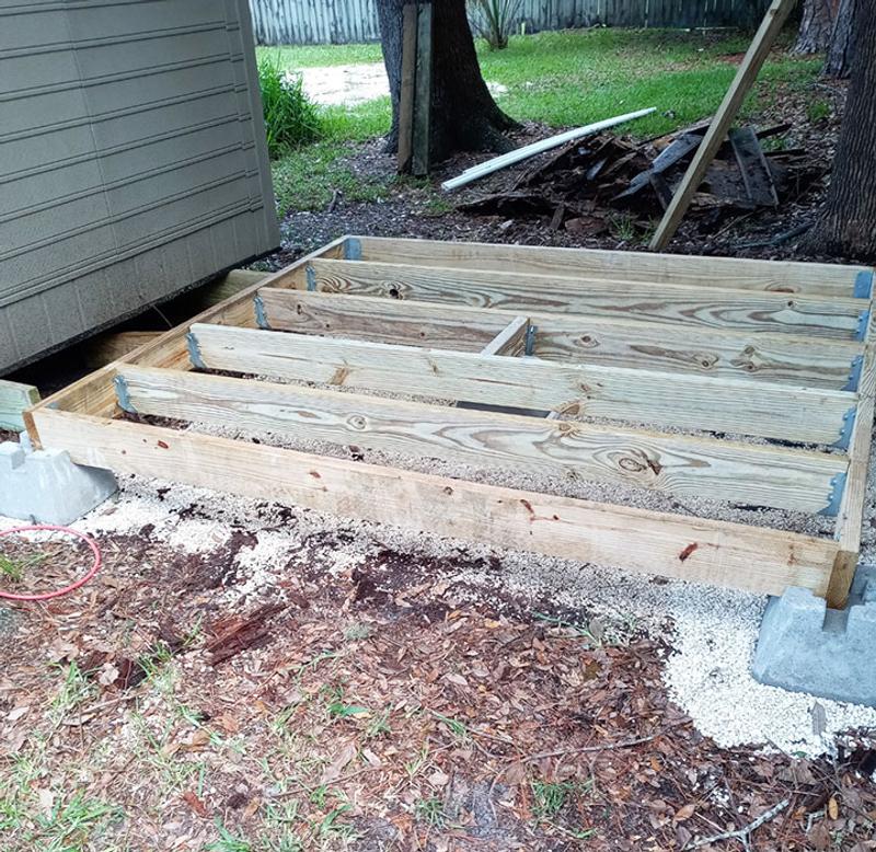 New platform raised off ground. Covered with Thompson treated plywood