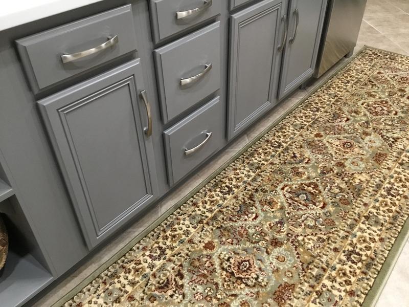 My new rug with grey cabinets.  My breakfast area furniture is natural wood and sage green.  The rug pulls everything together.