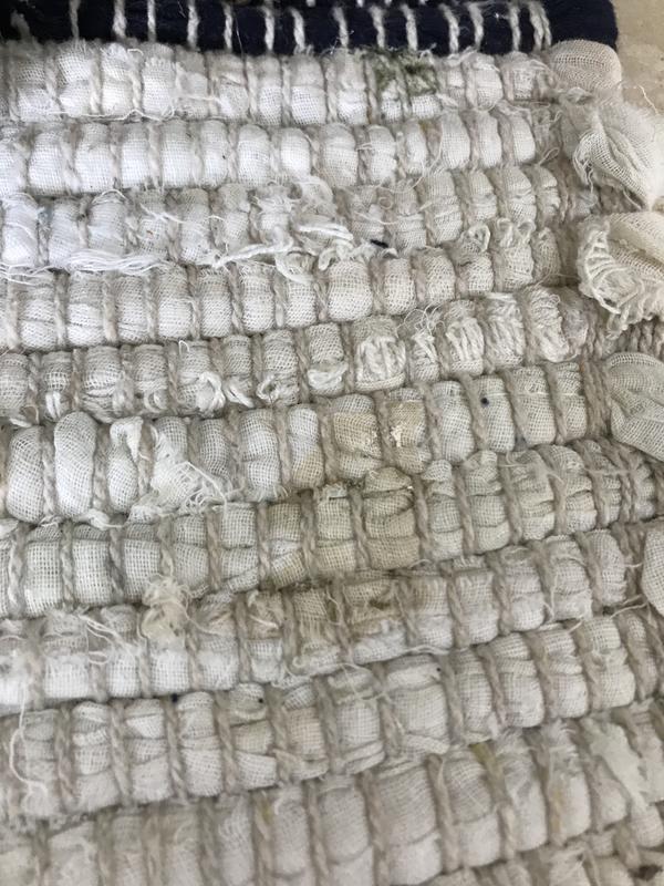 Stain. There are about 5 of these in one corner of the rug