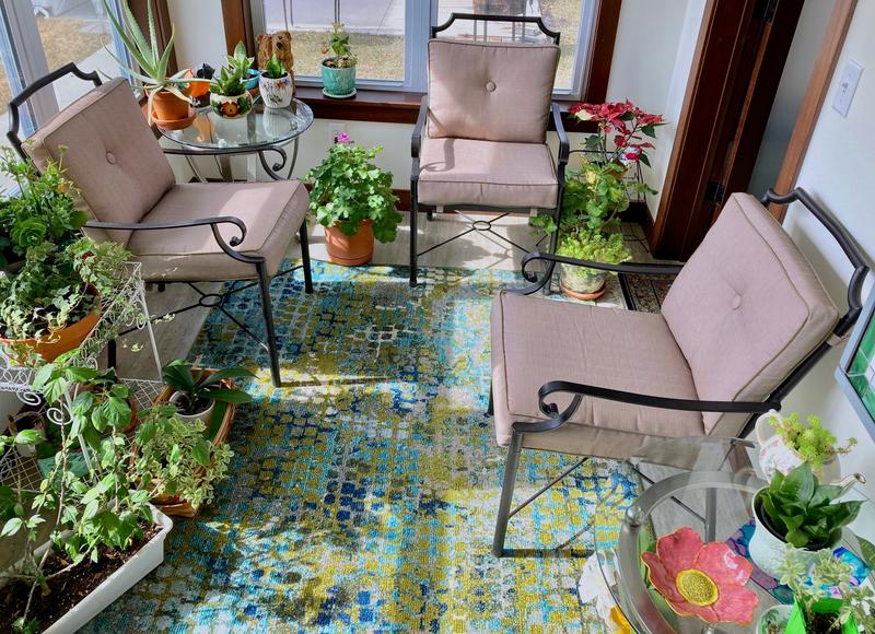 The 5' x 8' Blue Green Theia Rug fits perfectly into our small sun room!