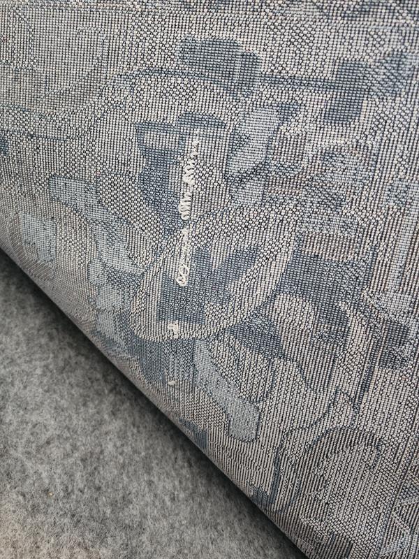 Back of rug where pulls are