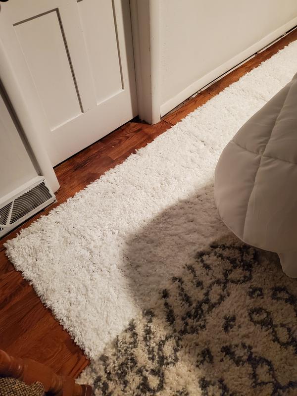 White shag layered with Morrocan runner