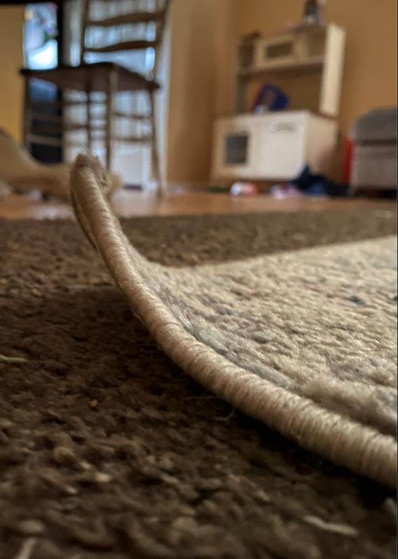 The corners of this rug do not lay flat, even when weighed down for days by something heavy.