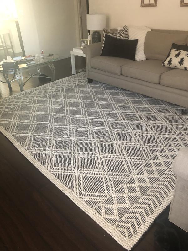 Ignore the messy couch-wanted to show the full rug before putting everything back together. You can see the wavy edge on one side- it’s getting better with time as it flattens out!