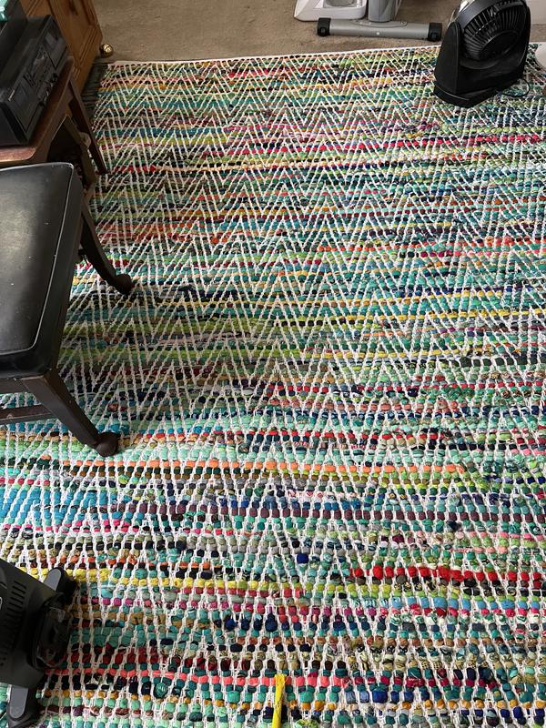 Rug laid out in living room.