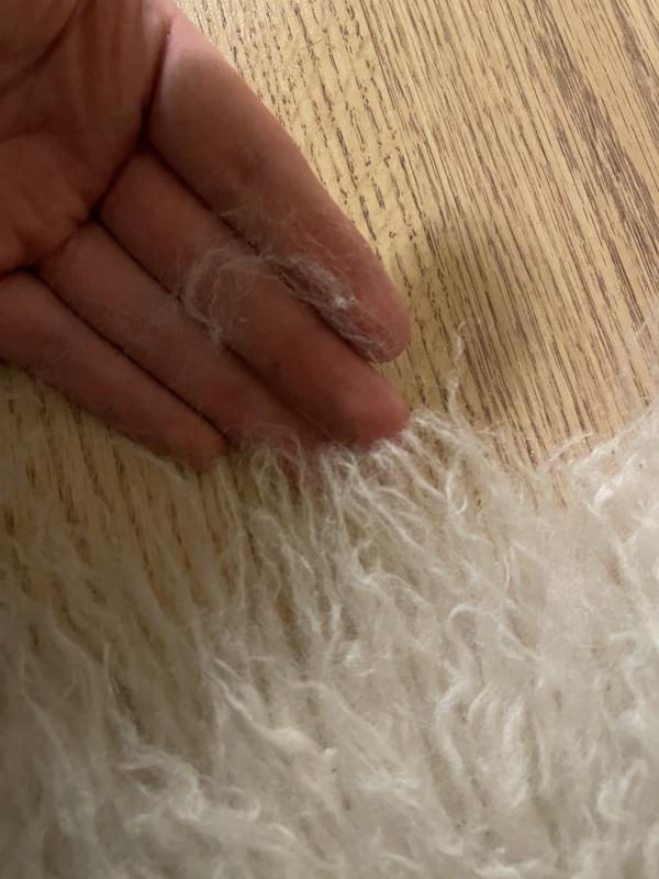 Extremely soft tug separates like cheap Halloween fake cob webs, fibers aren’t singular strands- they’re like dreadlocks of packed fuzzies. Very annoying