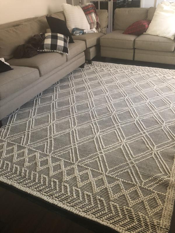 Ignore the messy couch-wanted to show the full rug before putting everything back together. You can see the wavy edge on one side- it’s getting better with time as it flattens out!