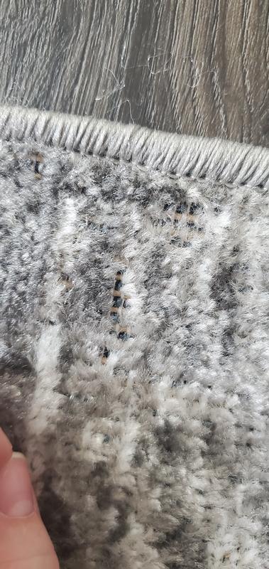 Photo of rug damage due to poor backing quality