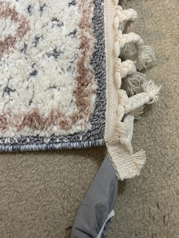 Gray end protector attached to tassels.