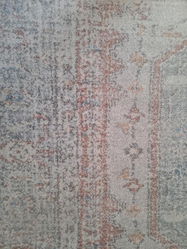 This part of the rug is covered by my dogs bed and looks like it did when we got it. For comparison to the first photo .