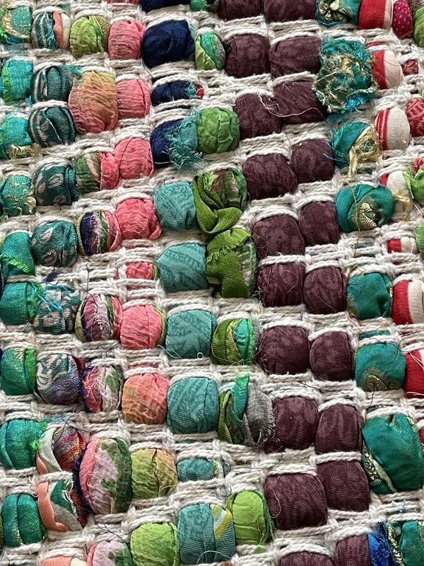 Close up of coarsely woven "popcorn" texture.