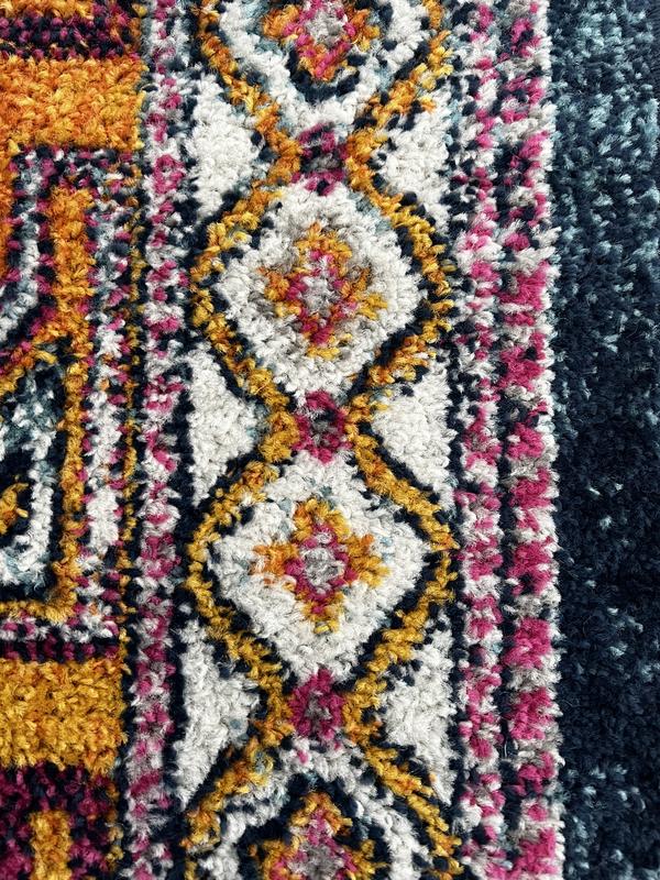 Close up of yellow “plus sign” shaped border.