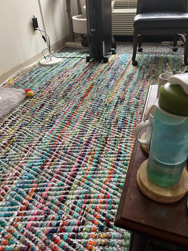 Rug covers living room floor.