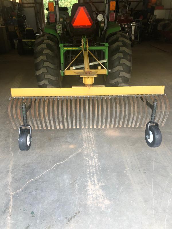 Landscape rake deals with wheels