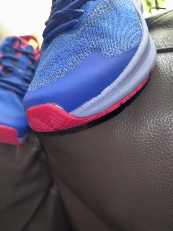 Customer photo for "Adhesive marks on sides of both sneakers"
