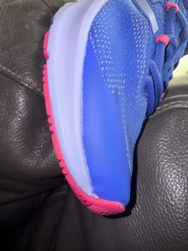 Customer photo for "Adhesive marks on sides of both sneakers"